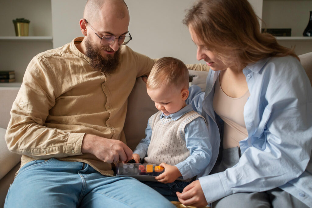 A child's hands and a therapist's hands working together on a puzzle, representing a collaborative approach to ABA therapy